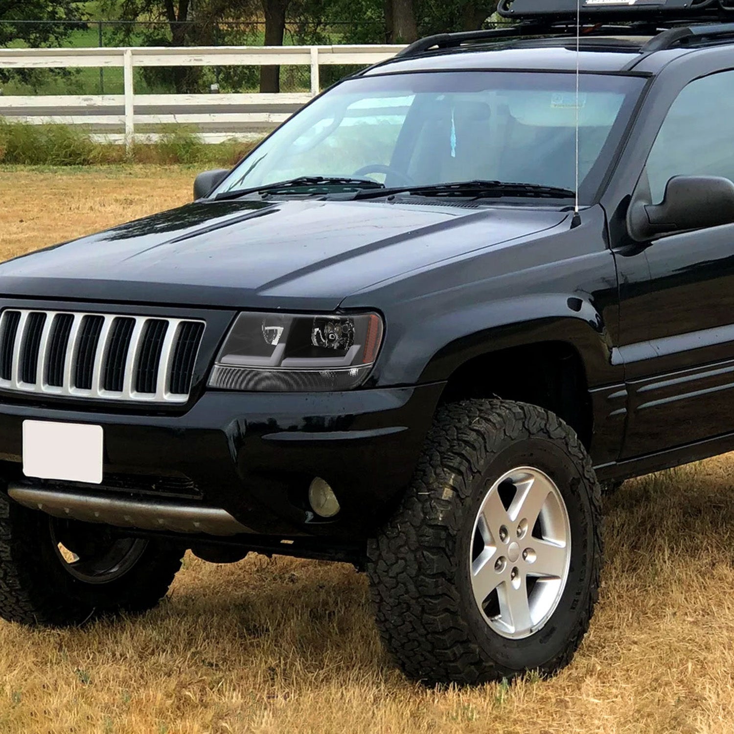 1999-2004 Jeep Grand Cherokee Factory Dual LED Bar Headlights Matt Black/Clear